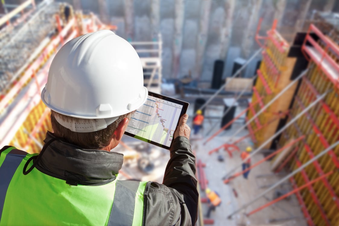 engineer architect construction worker on construction site with tablet computer